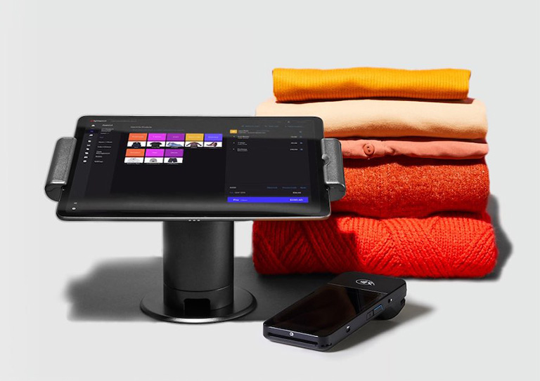 clothes on the counter with POS and payment terminal